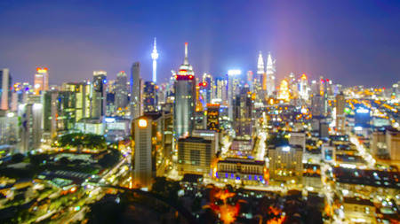 Blur image of kuala lumpur city skyline during blue hour Stock Photo