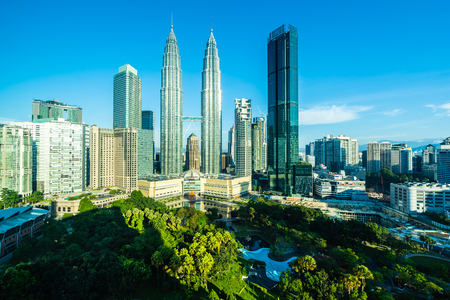 Beautiful architecture building exterior city in kuala lumpur skyline with white cloud and blue sky Stock Photo