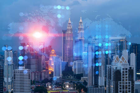 Hologram of earth planet map on night panoramic cityscape of kuala lumpur malaysia asia the concept of international companies in kl multi exposure Stock Photo