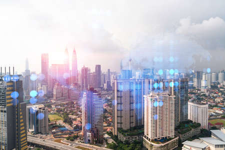 World planet earth map hologram over panorama city view of kuala lumpur malaysia asia the concept of international connections and business multi exposure Stock Photo