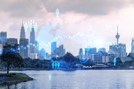 Hologram of social media icons over sunset panoramic cityscape of kuala lumpur malaysia asia the concept of people connections in kl multi exposure