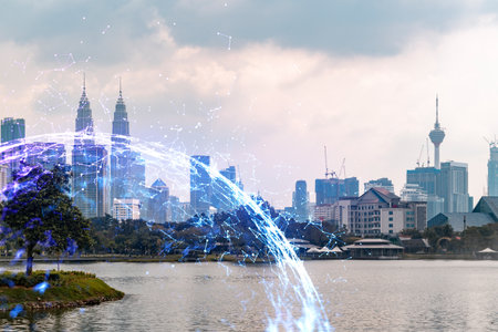 Hologram of abstract technology glowing icons panoramic cityscape of kuala lumpur at sunset malaysia asia the concept of worlds technological changes double exposure