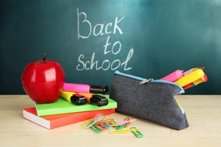 Back to school blackboard with pencil box and school equipment on table Stock Photo