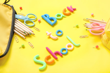 Text back to school and stationery on yellow background