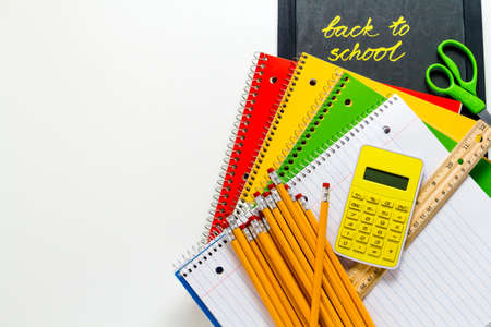 Variety of school supplies on a white background