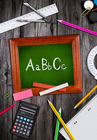 School supplies with blackboard close up Stock Photo