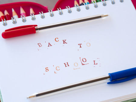 Back to school concept with red and blue pen and color pencils Stock Photo