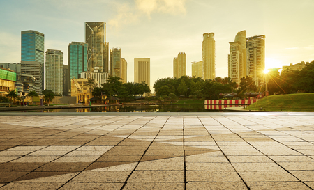 Beautiful sunrise view of modern buildings in kuala lumpur with empty floor Stock Photo