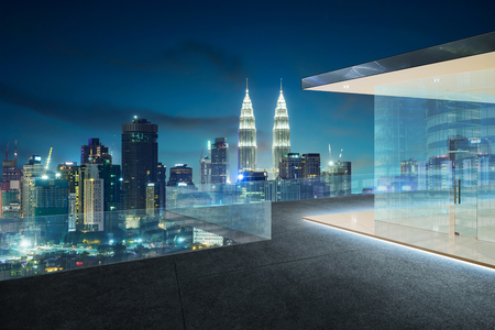 Kuala lumpur skyline at night with balcony view Stock Photo