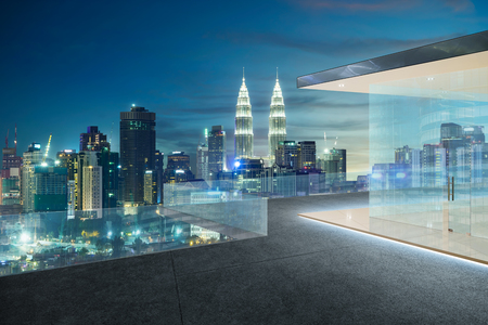 Kuala lumpur skyline at night with balcony view