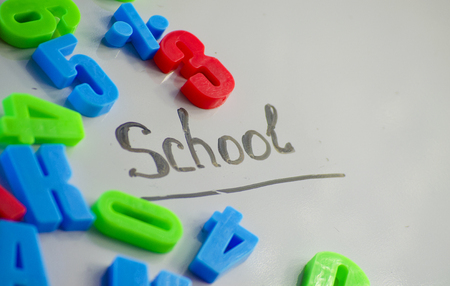 Letters and numbers to study in the school on a white background Stock Photo