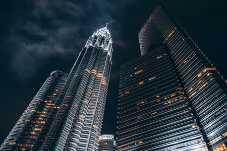 Petronas twin towers illuminated at night kuala lumpur city centre park